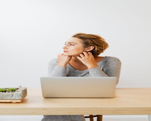 Person looking away from computer to rest eyes