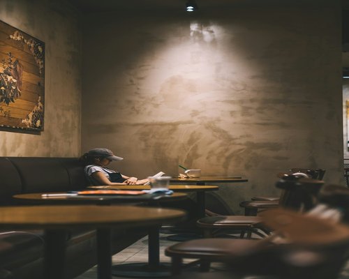 Reading inside a well lit modern cafe