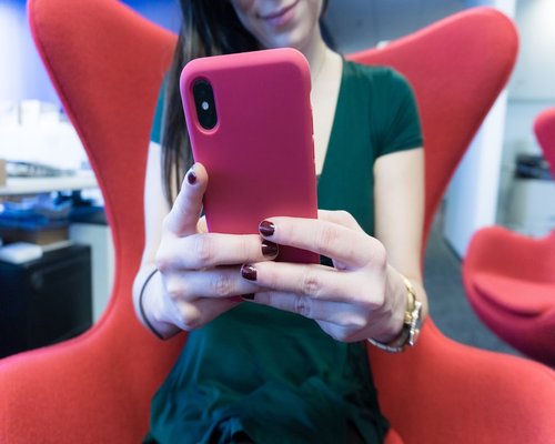 Woman holding smartphone at an ergonomic distance