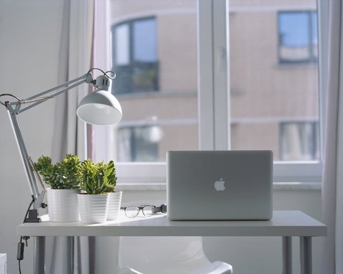 Laptop on a desk with balanced natural room lighting